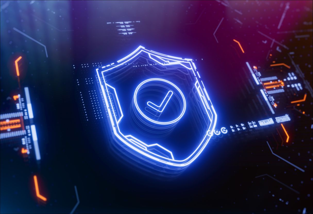 Neon lit shield icon on a black background